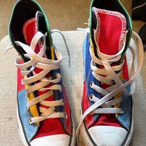 Multi colored primary converse high tops